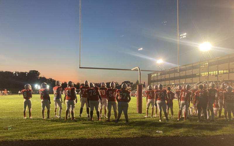 Ottawa's varsity football team waits in the end zone for the freshman game to end at King Field on Friday, Sept. 29, 2023.