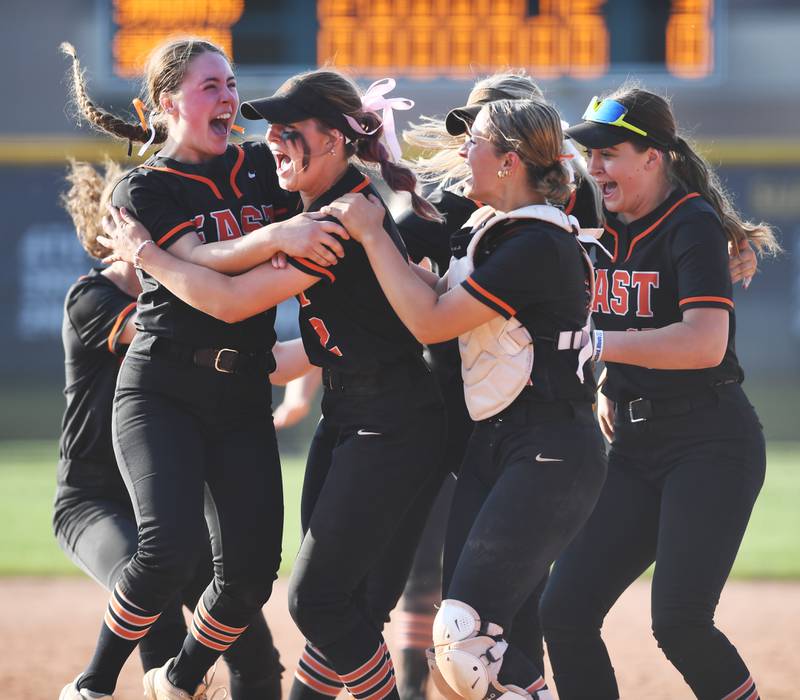 St. Charles East pitcher Makayla Van Dinther, left, celebrates with her teammates after the Fighting Saints won 5-0 against South Elgin during the Fremd Class 4A girls softball sectional final on Friday, June 6, 2025 in Palatine.