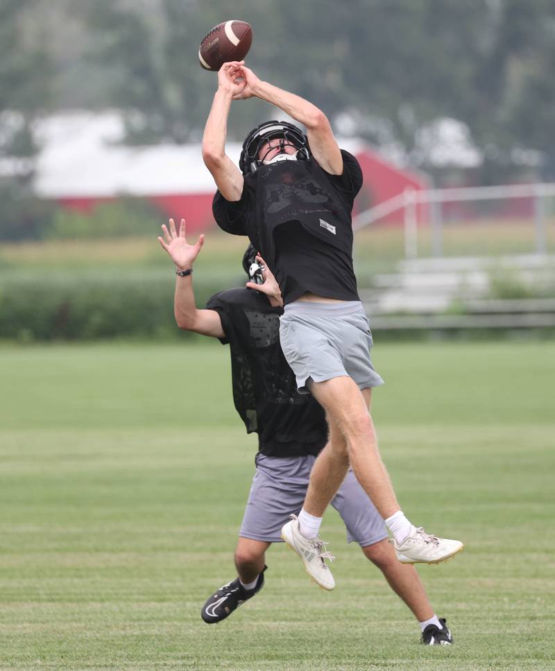 A Kaneland receiver makes a leaping attempt Monday, Aug. 18, 2025, during practice at the school in Maple Park.
