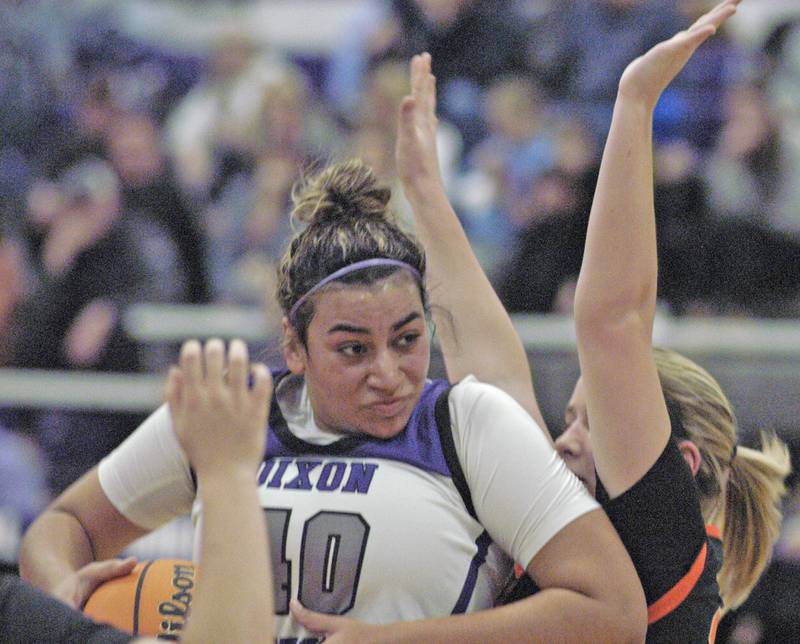 Dixon's Hallie Williamson powers to the basket against a Byron defender. The Dixon Duchesses hosted Byron in girls basketball Saturday, Jan. 25, 2025.