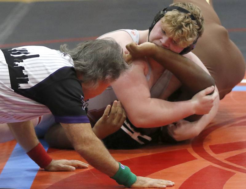 Marian Central's Kaleb Eckman pins Mt. Carmel's David Ajayi in their 285-pound match during a triangle wrestling meet on Saturday Jan. 11, 2025, between Marian Central, Joliet Catholic, and Mt. Carmel at Marian Central High School in Woodstock.