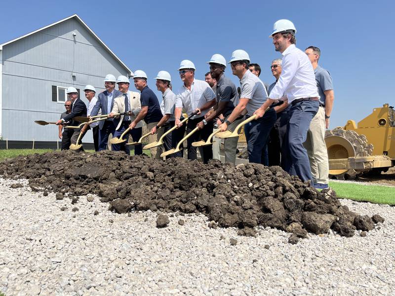 Company officials with Northern Builders celebrate the groundbreaking for the incoming Agile Cold Storage facility on Thursday, June 20, in Joliet.