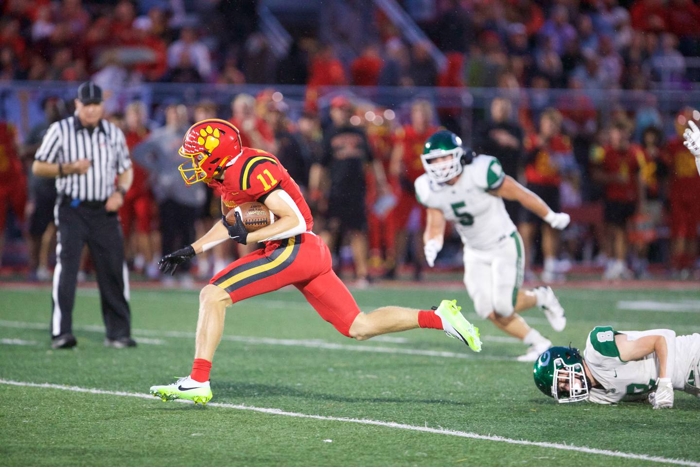 Batavia's Brett Berggen runs the ball for a gain against Glenbard West on Friday, Aug.29,2025 in Batavia.