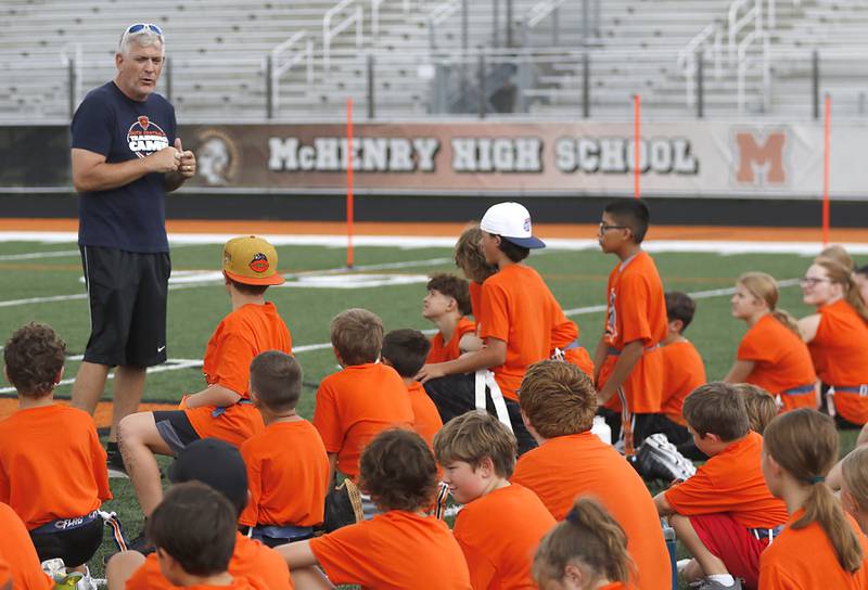 Former Chicago Bear Jim Schwantz talks to campers during the Chicago Bears Mini Monsters Flag Football Camp on Wednesday, July 16, 2025. at McCracken Field in McHenry.