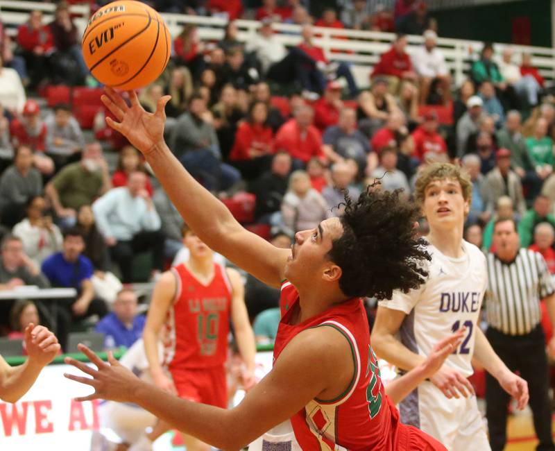 L-P's Marion Persich lets go of a shot under the hoop against Dixon during the Class 3A Regional semifinal game on Wednesday, Feb. 26, 2025 in Sellett Gymnasium at L-P High School.