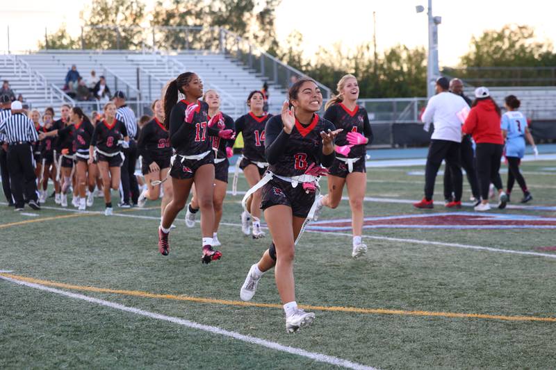 Yorkville's Bella Esquivel runs to celebrate with teammates following the Foxes' 26-13 victory over Kankakee on Tuesday, Oct. 7, 2025.