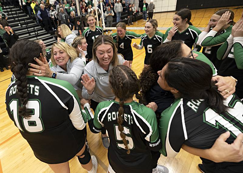 Rock Falls volleyball head coach Sheila Pillars (left) celebrates with her team after beating Chicago Christian in two sets Friday, Nov. 3, 2023 in the Class 2A volleyball supersectional in Sandwich.