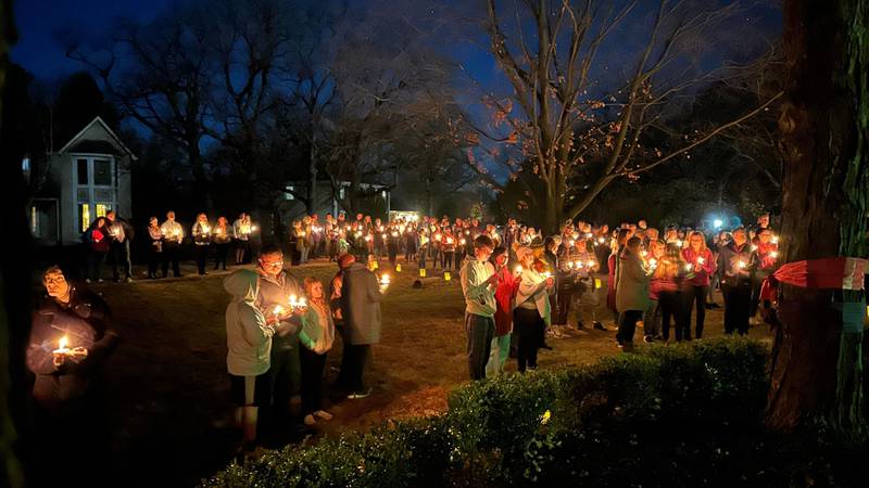 Many people gathered Sunday for a candlelight vigil for Grace Diewald, 20, and her brother, Emil, 19, who were killed after the Lexus SUV were riding in crashed into the back of a District 301 school bus Oct. 31.
