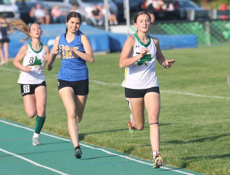 Seneca's Tenley Yandell (right) leads Somonauk's Emma Rominski and Seneca's Cora Chapman in the 800 meter run during the Class 1A Sectional meet on Thursday, May 14, 2026 at Seneca High School.