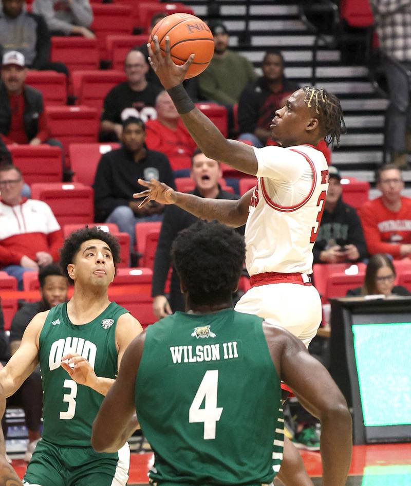 Northern Illinois Huskies guard Kaleb Thornton goes to the basket between three Ohio defenders during their game Tuesday, Feb. 7, 2023, in the Convocation Center at NIU in DeKalb.