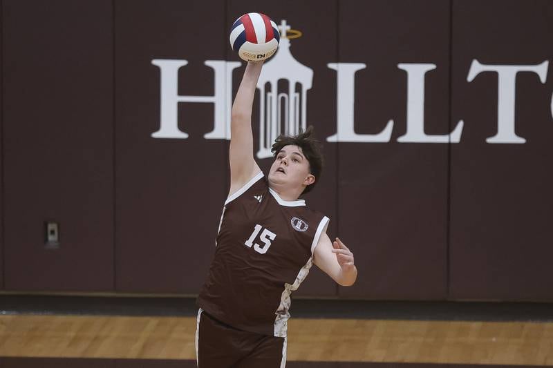 Joliet Catholic’s Benjamin Vercelote serves against Joliet Central on Wednesday, April 1, 2026 in Joliet.