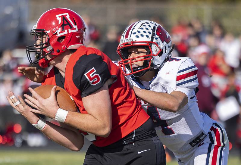 Amboy’s Rylan McNinch hauls in a pass against West Central’s Gage Stimpson Saturday, Nov. 2, 2024, in the 8-man football league first round playoffs.