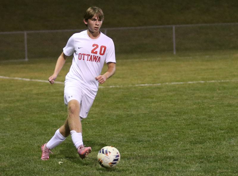 Ottawa's Jacob Phelps pases the ball off during the Class 2A Regional semifinal game on Monday, Oct. 20, 2025 at Ottawa HIgh School.