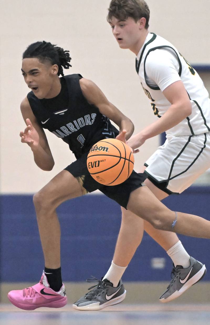 Willowbrook’s Jaylen Griffin tries to get past Fremd’s Charlie Chlan in a Chuck Mitchell Basketball Tournament boys basketball game at Fenton High School in Bensenville on Tuesday, Nov. 26, 2024.