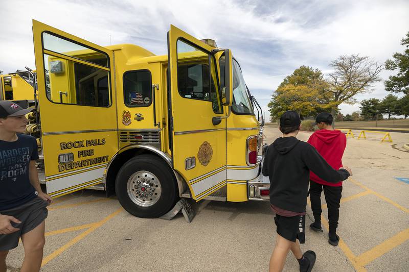 Students from Morrison tour a Rock Falls firetruck set up on display Friday, Oct. 17, 2025, at the eighth grade career fair at SVCC.
