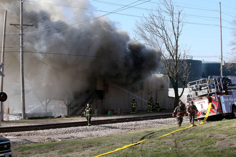 Ottawa firefighters arrive to the scene of fire at the former Platform 31 tavern on Monday, March 24, 2025 on Water Street in Peru. The fire was upgraded to a three-alarm summing ire departments from La Salle, Utica, Mendota, Tonica, Ottawa, Ladd, Spring Valley, Lostant, Cedar Point, Troy Grove and Peru responded to the fire.
