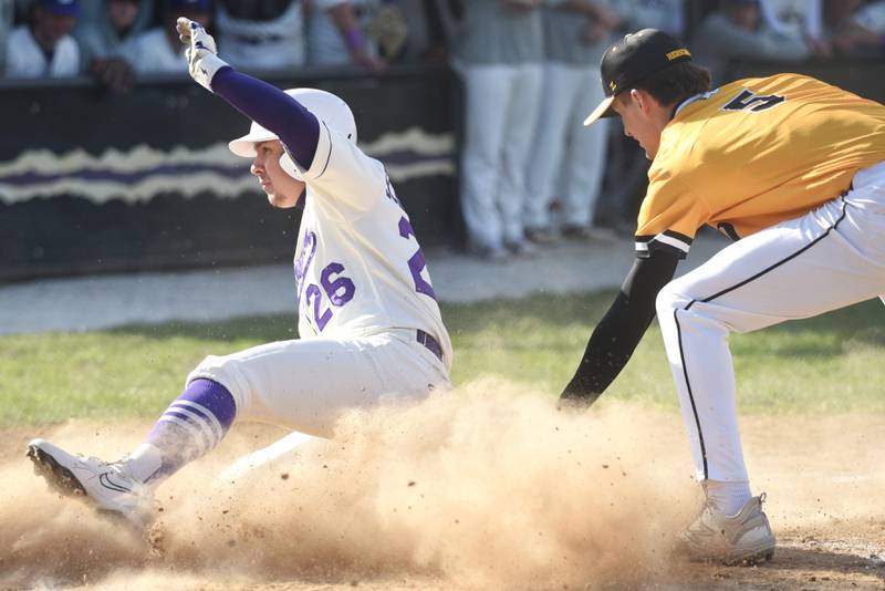 Wilmington's Ryan Schraeger, left, slides in for a run ahead of a late tag from Herscher's Tanner Jones during a game at Wilmington Tuesday, April 7, 2026.