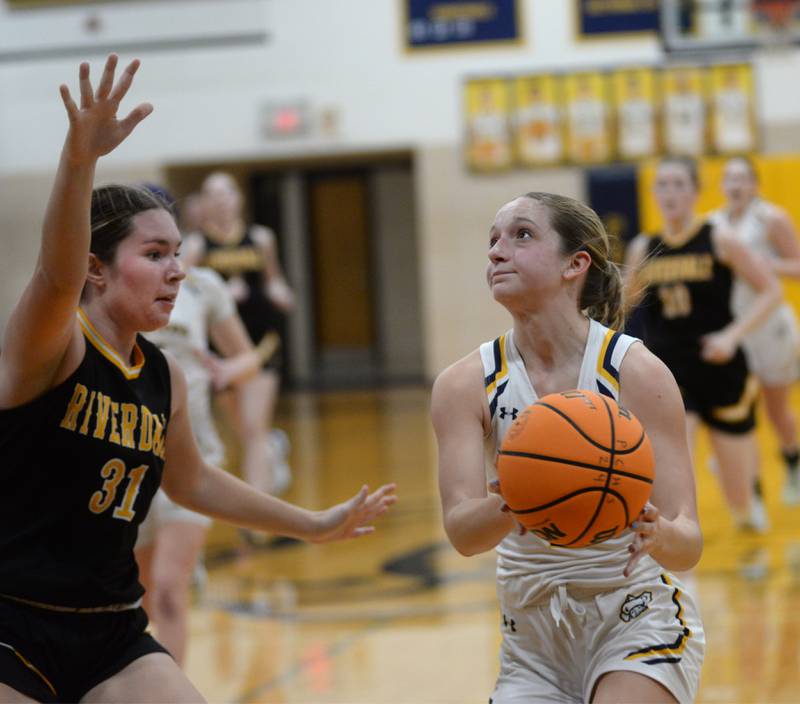 Polo's Laynie Mandrell (2) looks to the basket as Riverdale's Adysen McLaughlin defends on Saturday, Jan. 18, 2025 at Polo High School.