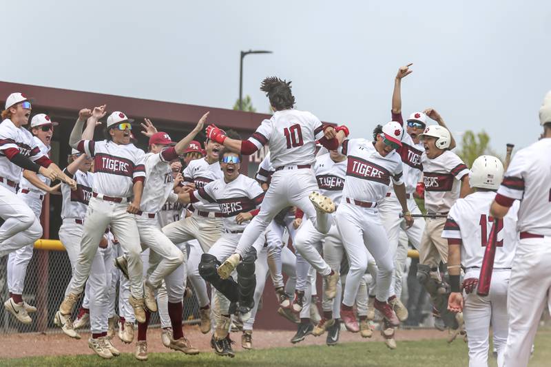 Plainfield North's Brendan Henderson (10) celebrates his late homerun with teammates during Class 4A Plainfield North Regional final baseball game between Oswego at Plainfield North. Saturday, May 31, 2025 in Plainfield.