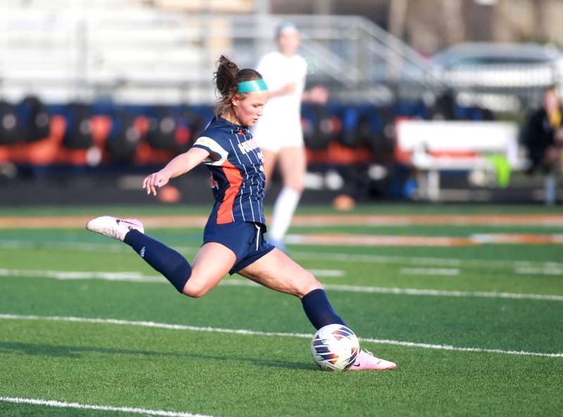 Naperville North's Emily Buescher kicks the ball during a game against Lyons Township on Wednesday, April 16, 2025 in Naperville.