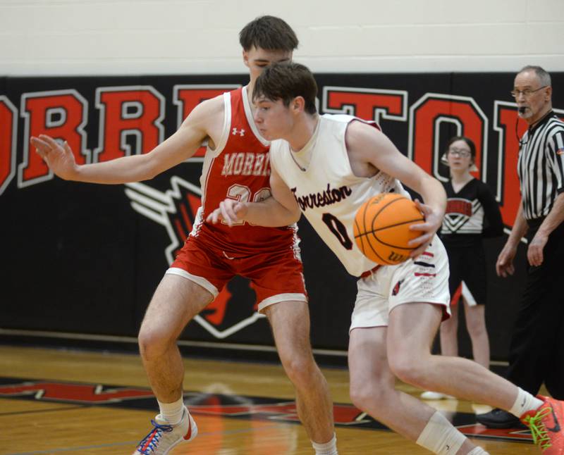 Forreston's Brendan Greenfield (00) makes a move to the basket as Morrison's Asher Ernst defends during a Saturday, Feb. 8, 2025 game at Forreston High School.