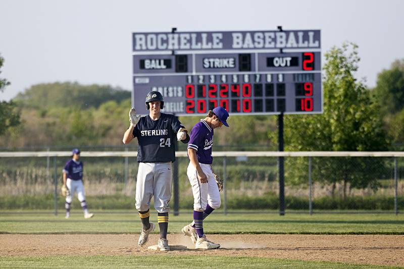 Sterling’s Braden Hartman celebrates a two-run double to put the Warriors ahead in the 7th inning against Rochelle in class 3A regional action on Monday, May 22, 2023.