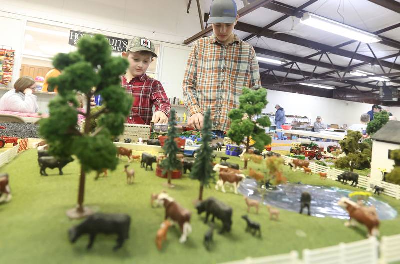 Detroit and Case Holdgrafer of Spragueville Iowa, set up their model farm display during the Model Train and Toy Show on Saturday, Feb. 14, 2026 at the Bureau County Fairgounds in Princeton.