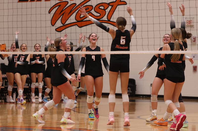Lincoln-Way West celebrates a set win against Joliet West on Monday, Sept. 30, 2024 in New Lenox.