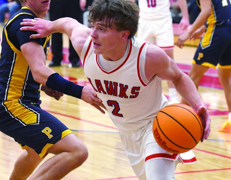 Oregon's Cooper Johnson (2) drives the baseline against Polo during a Friday, Dec. 5, 2025 game at the Blackhawk Center in Oregon.