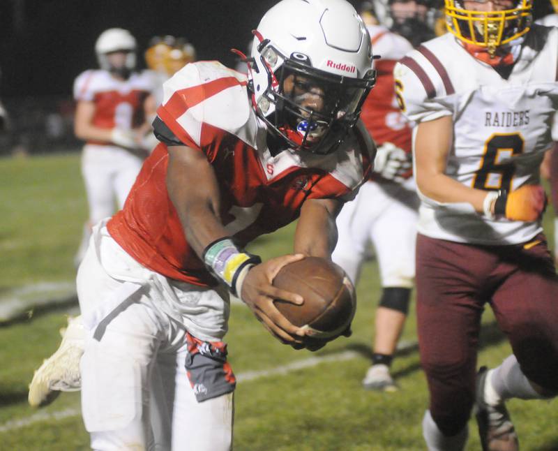 Isaiah Brown reaches over the goal line for a touchdown against East Peoria at Deiken Stadium on Friday, Aug. 25, 2023.