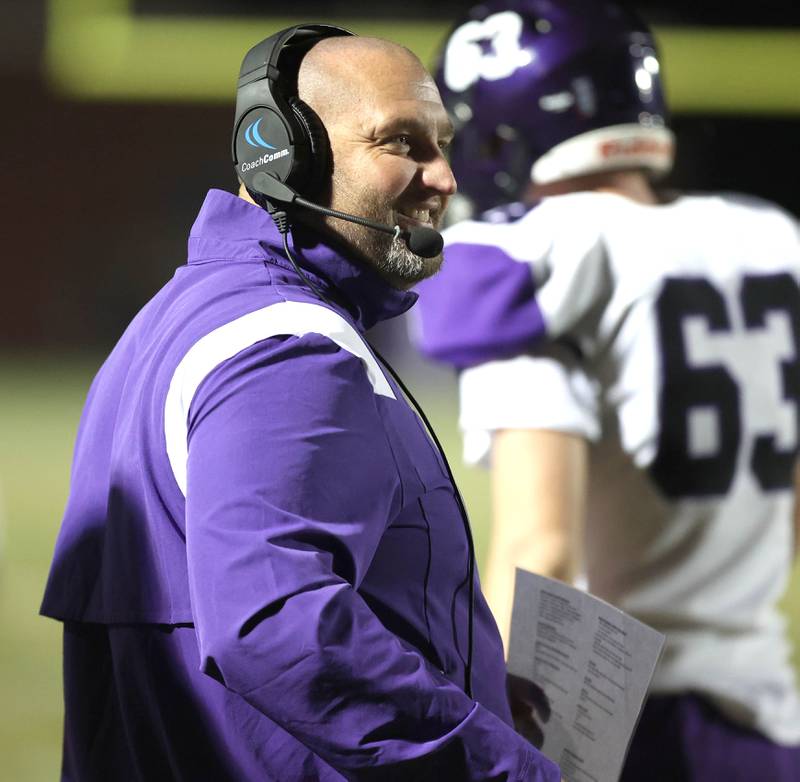 Dixon head coach Jared Shaner smiles after his team scored a touchdown during their first round playoff game against Rochelle Friday, Oct. 28, 2022, at Rochelle High School.