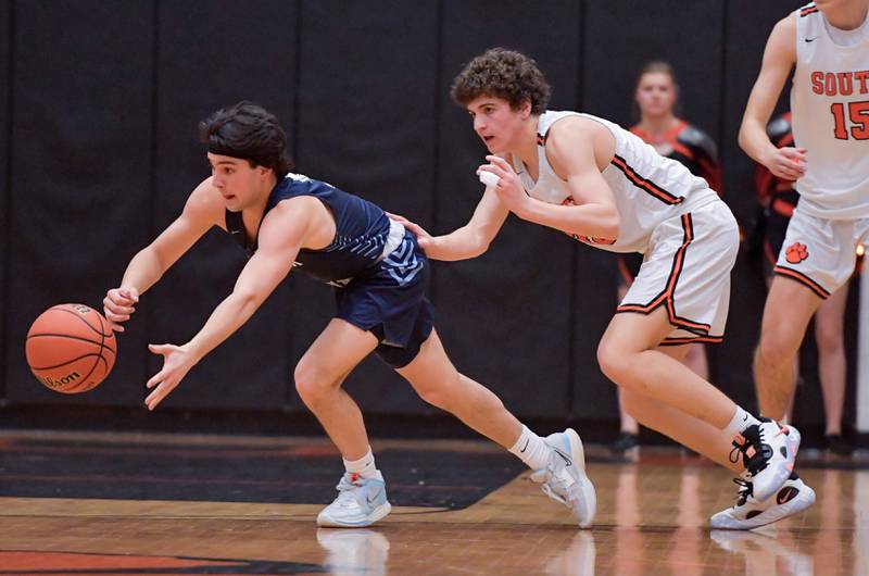 Lake Park's Adrian Notardonato (3) and Wheaton Warrenville South's Luca Carbonaro (30) go after a loose ball during a game on Saturday, Jan. 7, 2023.