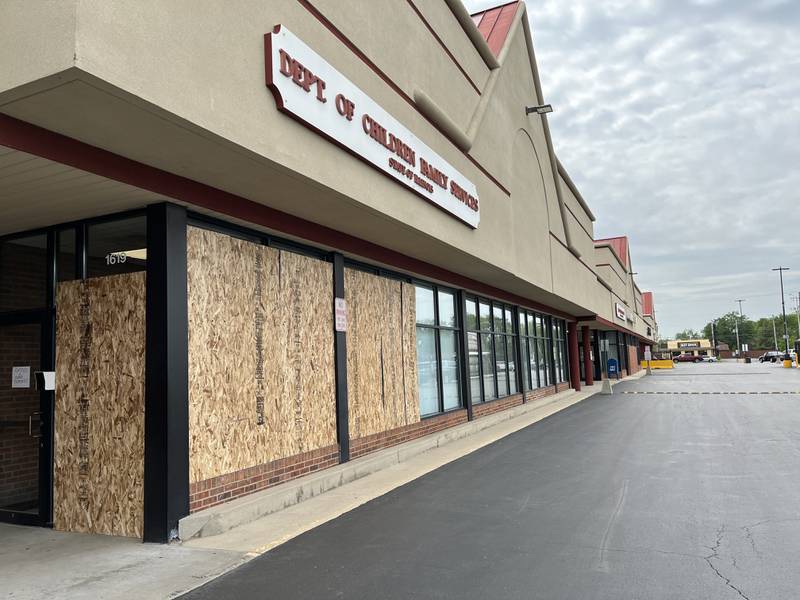 Boarded-up windows at the Joliet office for the Illinois Department of Human Services, 1619 W. Jefferson St., seen on Tuesday, May 24, 2022. A shooting reported on Saturday, May 21, 2022, caused damage to the windows to the building.