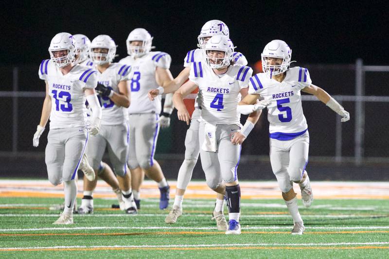 Burlington Central celebrates a touchdown against McHenry on Friday, Oct. 21,2022 in McHenry.