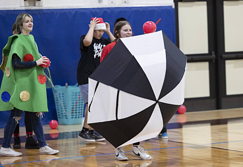 Members of the Grinch squad break out all sorts of tools to protect themselves from the onslaught of dodgeballs Saturday, Nov. 18, 2023.
