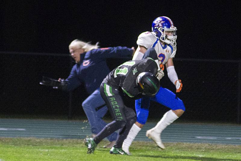 Rock Falls’ Kohle Bradley shoves G-K’s Brody Engel out of bounds Friday, Sept. 23, 2022 against Genoa-Kingston.