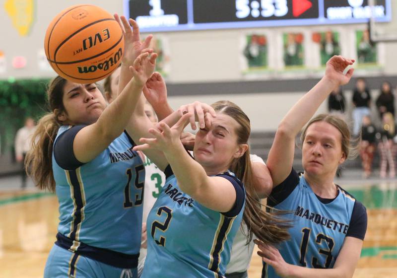 Marquette players (from left) Sonya Mitre, Kinley Rick, and Emily Ryan-Adair battle for a loose ball against Seneca on Thursday, Feb. 5, 2026 at Seneca High School.