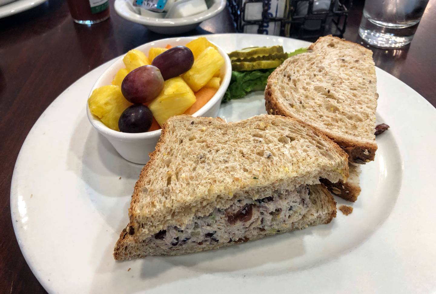 My fellow diner ordered the chicken salad sandwich ($12) with a side of fruit.