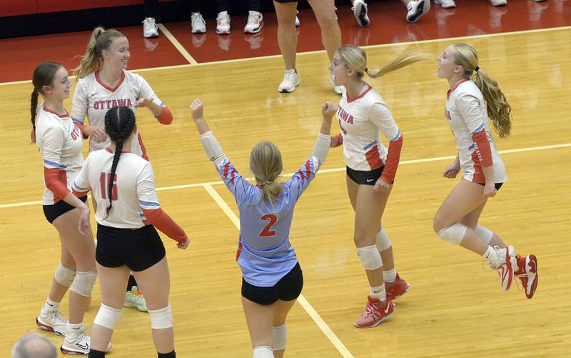 The Lady Pirates celebrate after tying the score late in the 1st set against Morris Tuesday at Ottawa.