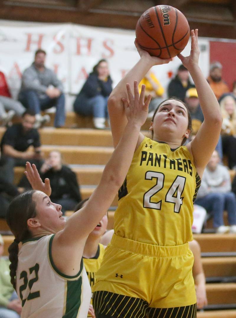 Putnam County's Maggie Richetta eyes the hoop as St. Bede's Ella Hermes defends during the Tri-County Conference Tournament championship game on Thursday, Jan. 18, 2024 at Henry-Senachwine High School.
