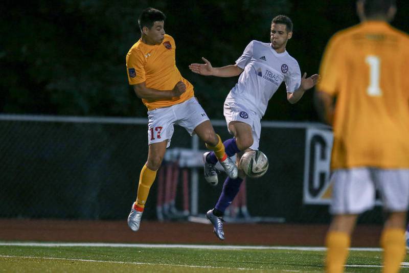 Aurora Borealis midfielder Anthony Parra  (17) plays the ball against Oakland County FC at Mooseheart High School in Mooseheart July 08.