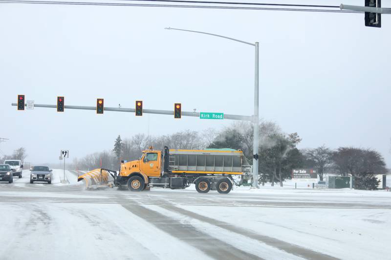 A plow truck travels south on Kirk Road as the temperatures dip below zero on Friday, Dec. 23, 2022.
