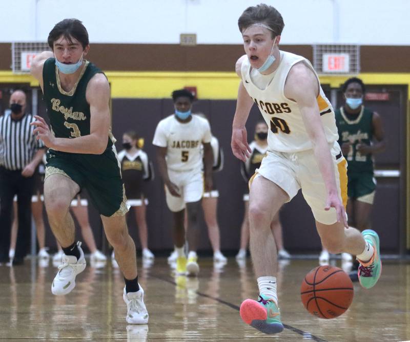Jacobs’ Nick McCoy cruises up court during boys varsity basketball against Rockford Boylan at Algonquin Saturday afternoon.