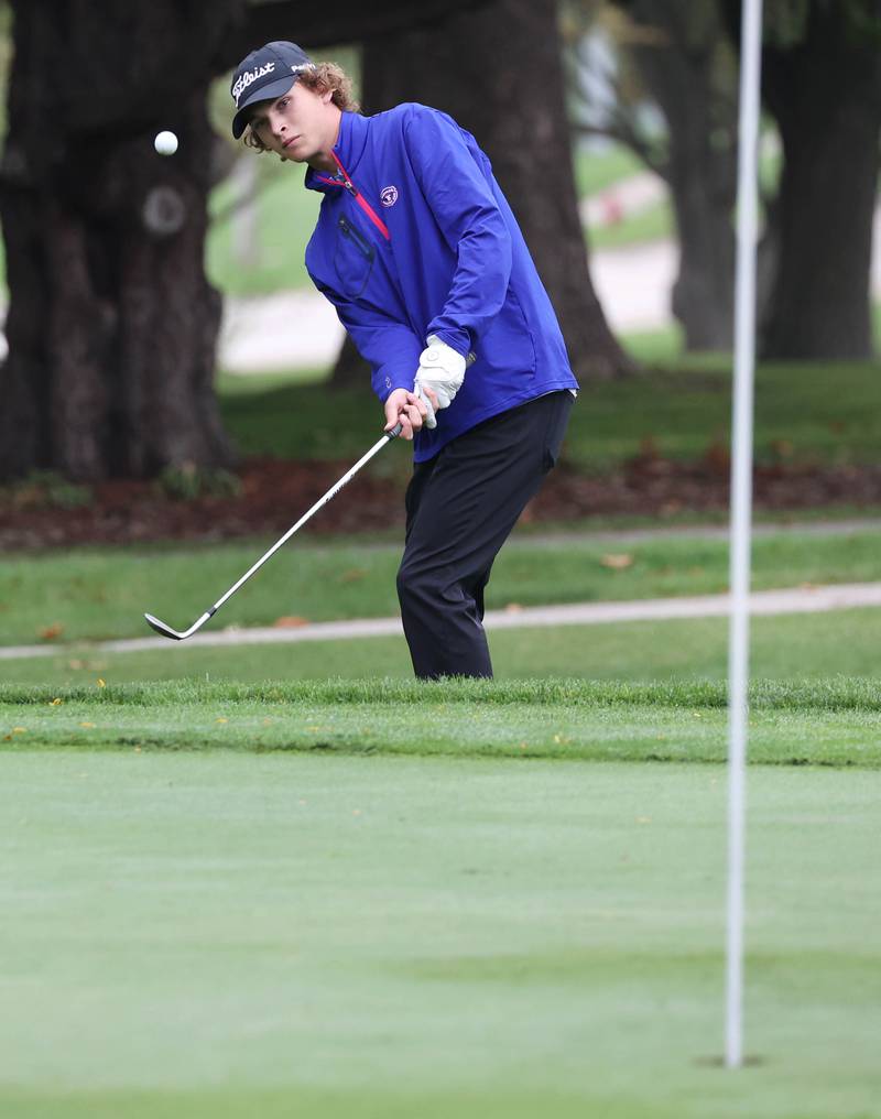 Burlington Central’s Camden Sarallo chips onto the green Wednesday, Sept. 27, 2023, during the Class 2A boys golf regional at Sycamore Golf Club.