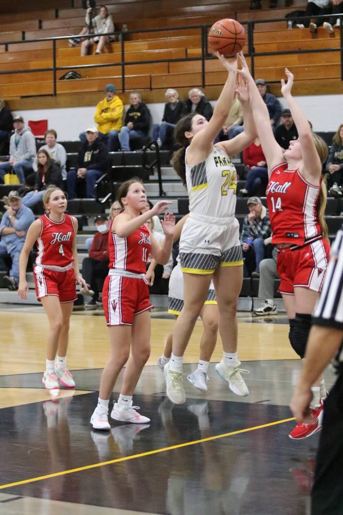 Hall's Ella Sterling  (14) defends against Putnam County's Maggie Richetta in Friday's nonconference game in Granville. PC won 39-33.