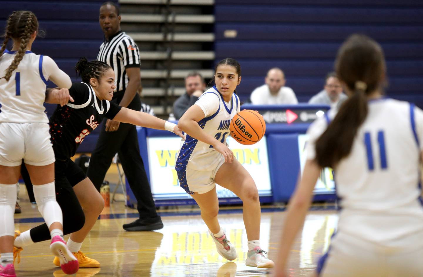 Wheaton North’s Sara Abdul drives toward the basket during a game on Tuesday, Dec. 10, 2024 against St. Charles East in Wheaton.