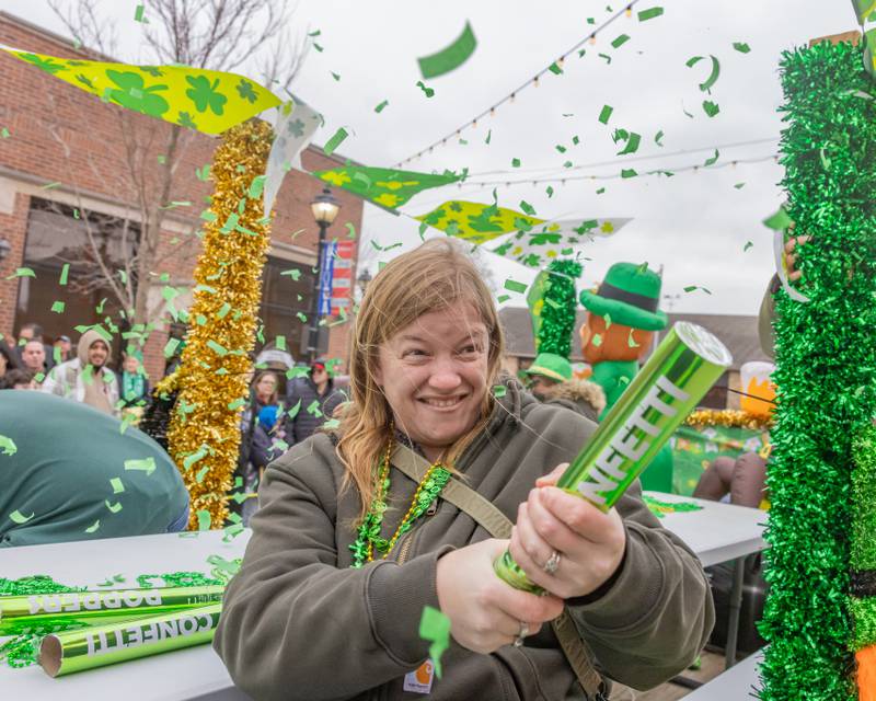 Carissa Kessel fires a confetti canon from a float during the St. Patrick's Day Parade on March 7, 2026 in Utica.