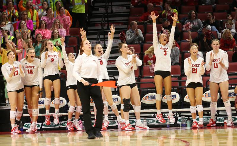 Members of the Benet Academy volleyball team celebrate after defeating Huntley during the Class 4A State semifinal game on Friday, Nov. 15, 2024 at CEFCU Arena in Normal.