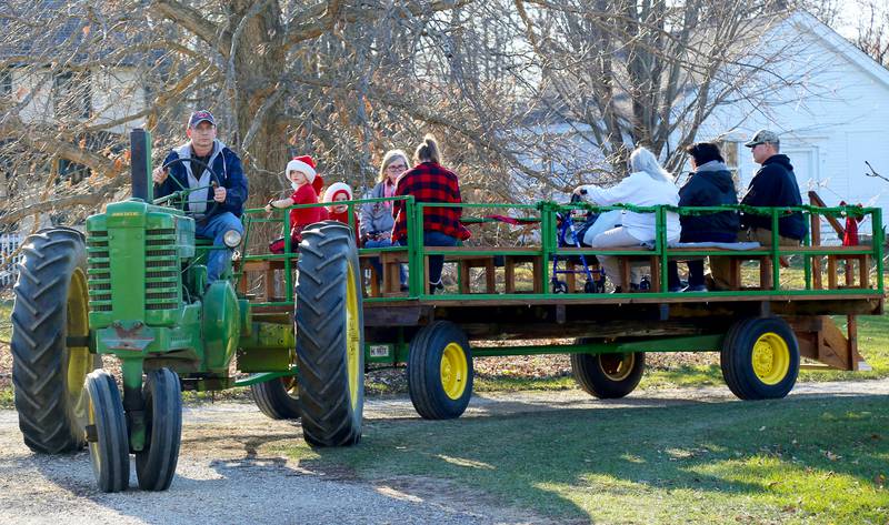 Attendees of the Kendall County Historical Society’s Annual Christmas at the Lyon Farm go on a hayride on Sunday, Dec. 8, 2024 in Yorkville.
