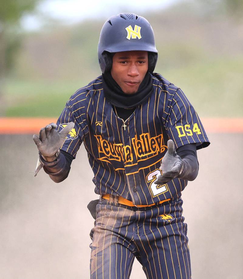 Neuqua Valley's Jaleel Glover celebrates after a base hit Tuesday, May 5, 2026, during their game at DeKalb High School.